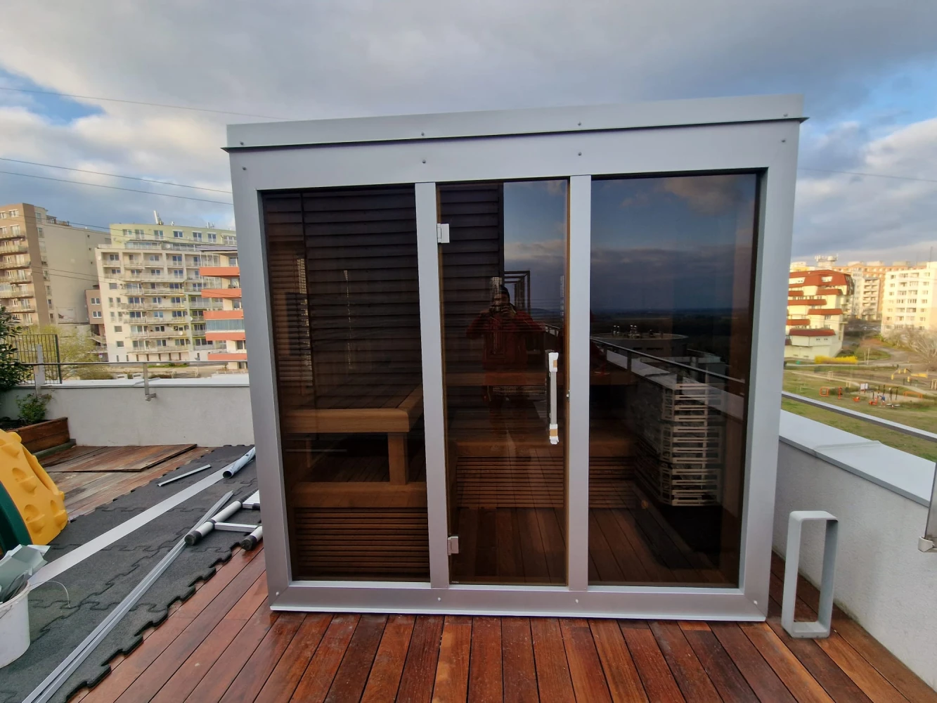 Outdoor sauna on a terrace with sheet metal cladding
