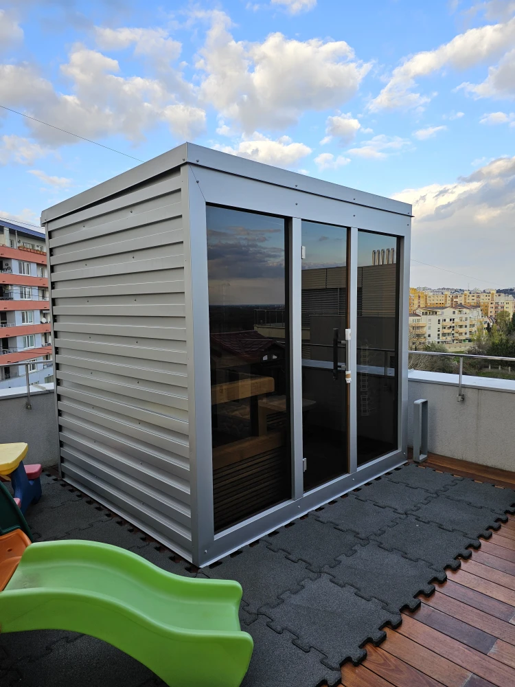 Outdoor sauna on a terrace with sheet metal cladding